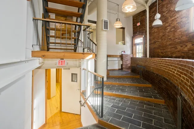 a view of balcony with wooden floor and fence