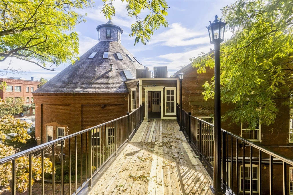 244 Main Street Northampton, MA 01060 - Photo 24 of 28 a view of balcony with wooden floor and fence