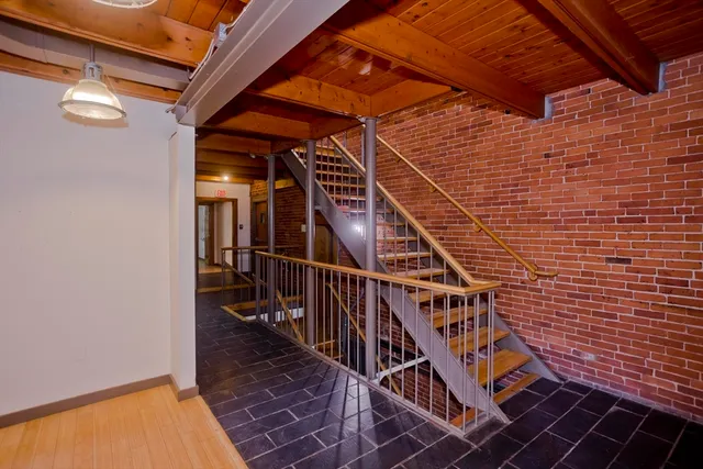 a view of an empty room with windows