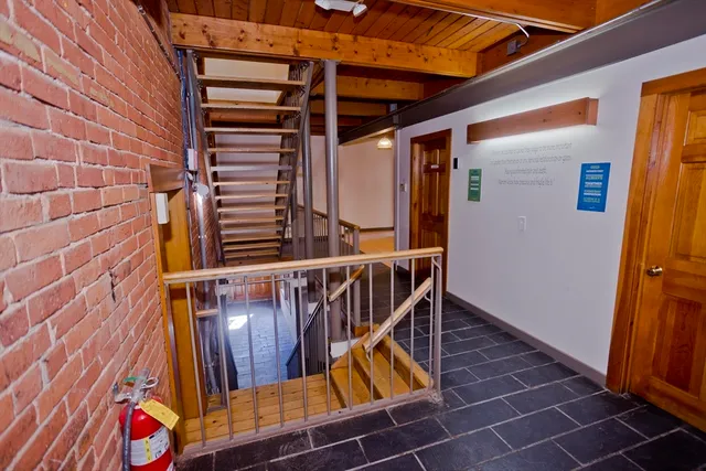 a view of an empty room with windows