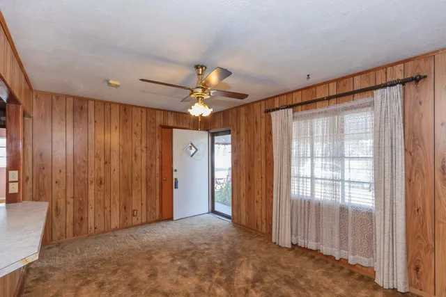 a kitchen with stainless steel appliances granite countertop a sink a stove cabinets and wooden floor