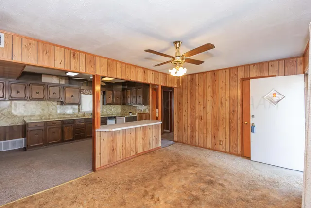 a view of an empty room with a fireplace