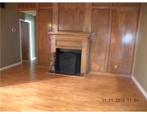 7201 Rugged Ridge Drive Corpus Christi, TX 78413 - Photo 3 of 4 a view of empty room with wooden floor and fireplace