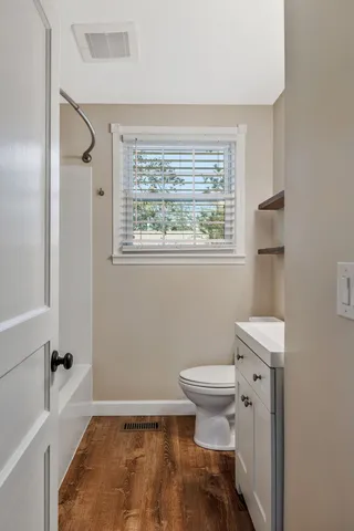 a bathroom with a toilet a sink and a bathtub