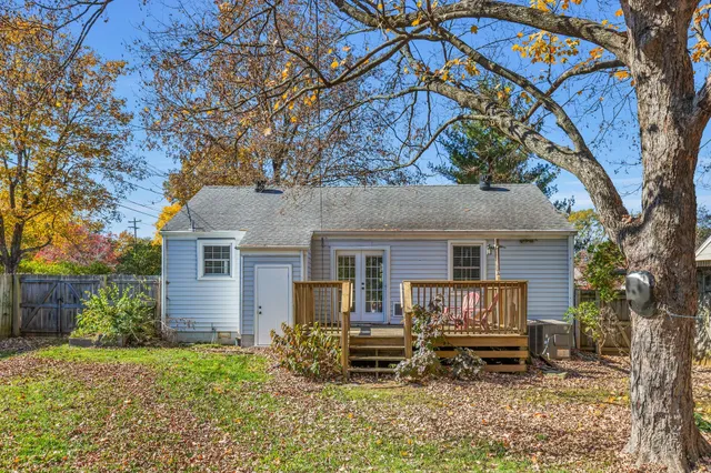 a house view with a sitting space and garden