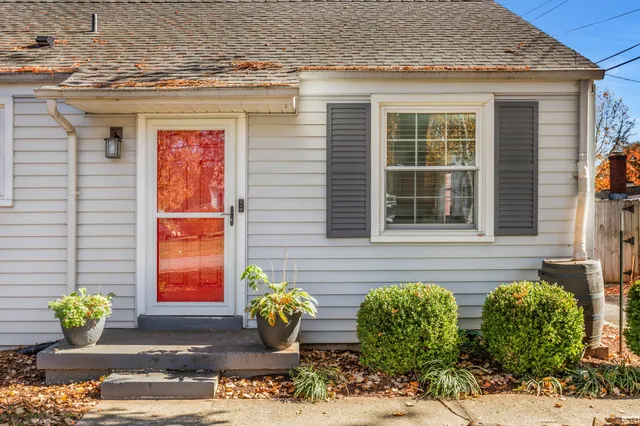 a front view of a house with outdoor seating