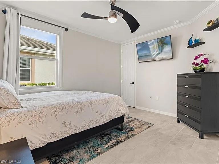 14672 Edgewater Circle Naples, FL 34114 - Photo 14 of 41 a bedroom with a bed and cabinets