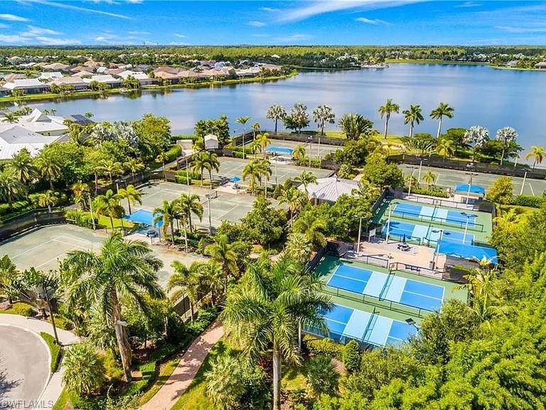 14672 Edgewater Circle Naples, FL 34114 - Photo 33 of 41 a view of a lake with a city view