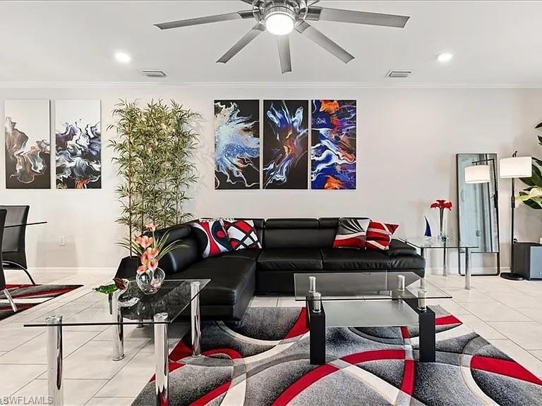 14672 Edgewater Circle Naples, FL 34114 - Photo 4 of 41 a living room with furniture and musical instruments