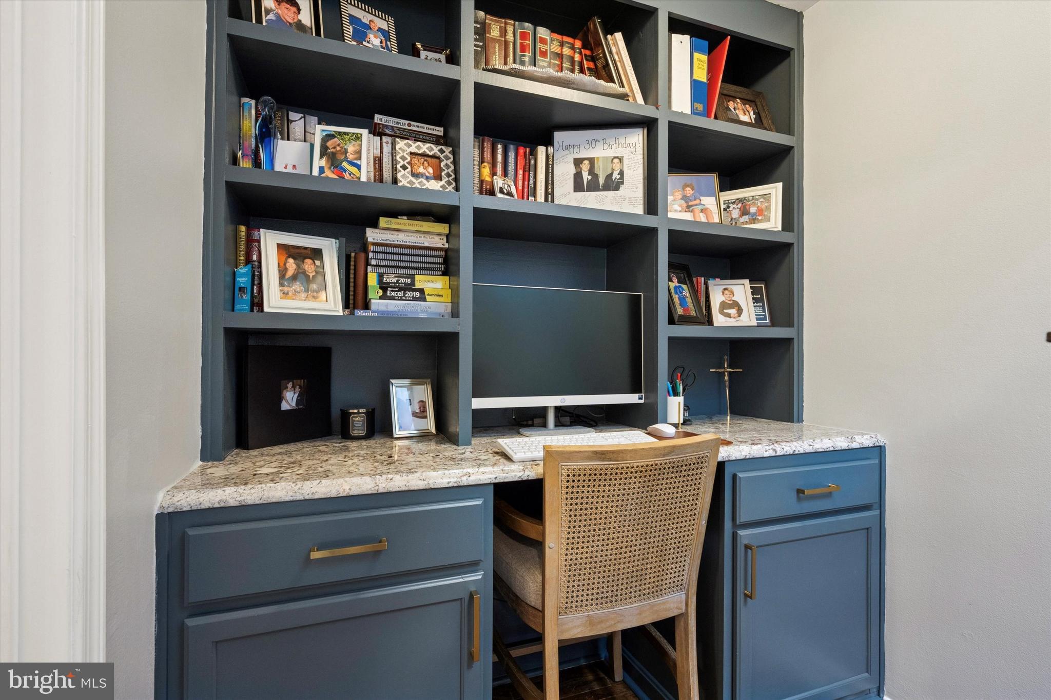 315 Fitzwater Street Philadelphia, PA 19147 - Photo 17 of 32 a room that has a bookshelf and a table in it