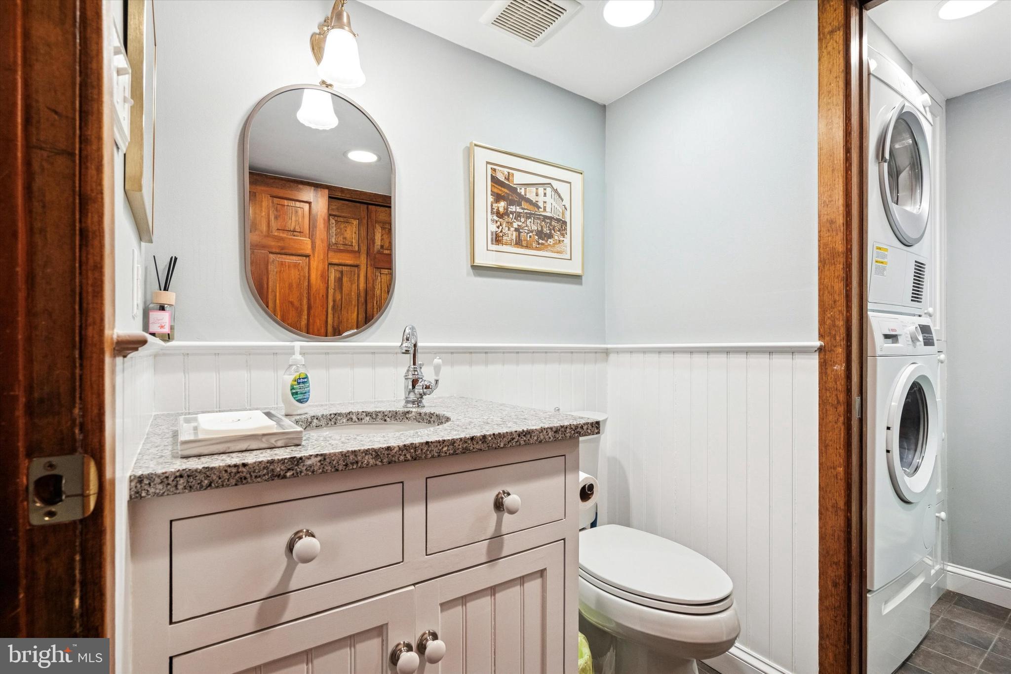 315 Fitzwater Street Philadelphia, PA 19147 - Photo 18 of 32 a bathroom with a granite countertop toilet sink and mirror