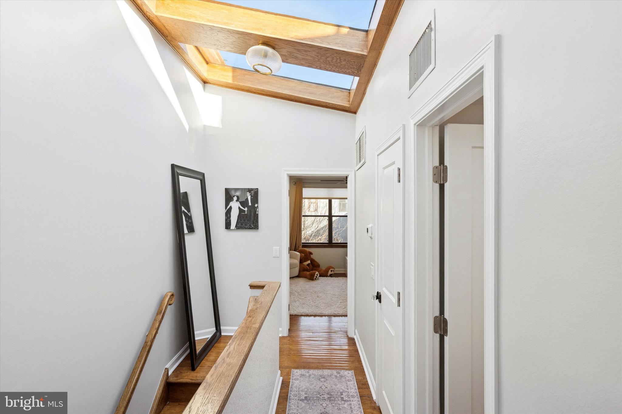 315 Fitzwater Street Philadelphia, PA 19147 - Photo 19 of 32 a view of a hallway with a hardwood and door