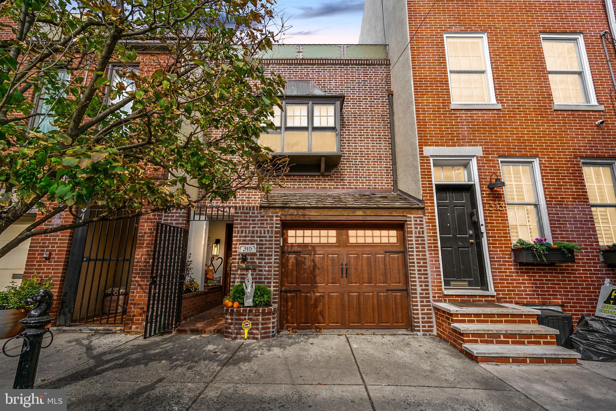 315 Fitzwater Street Philadelphia, PA 19147 - Photo 2 of 32 a front view of a house with a tree