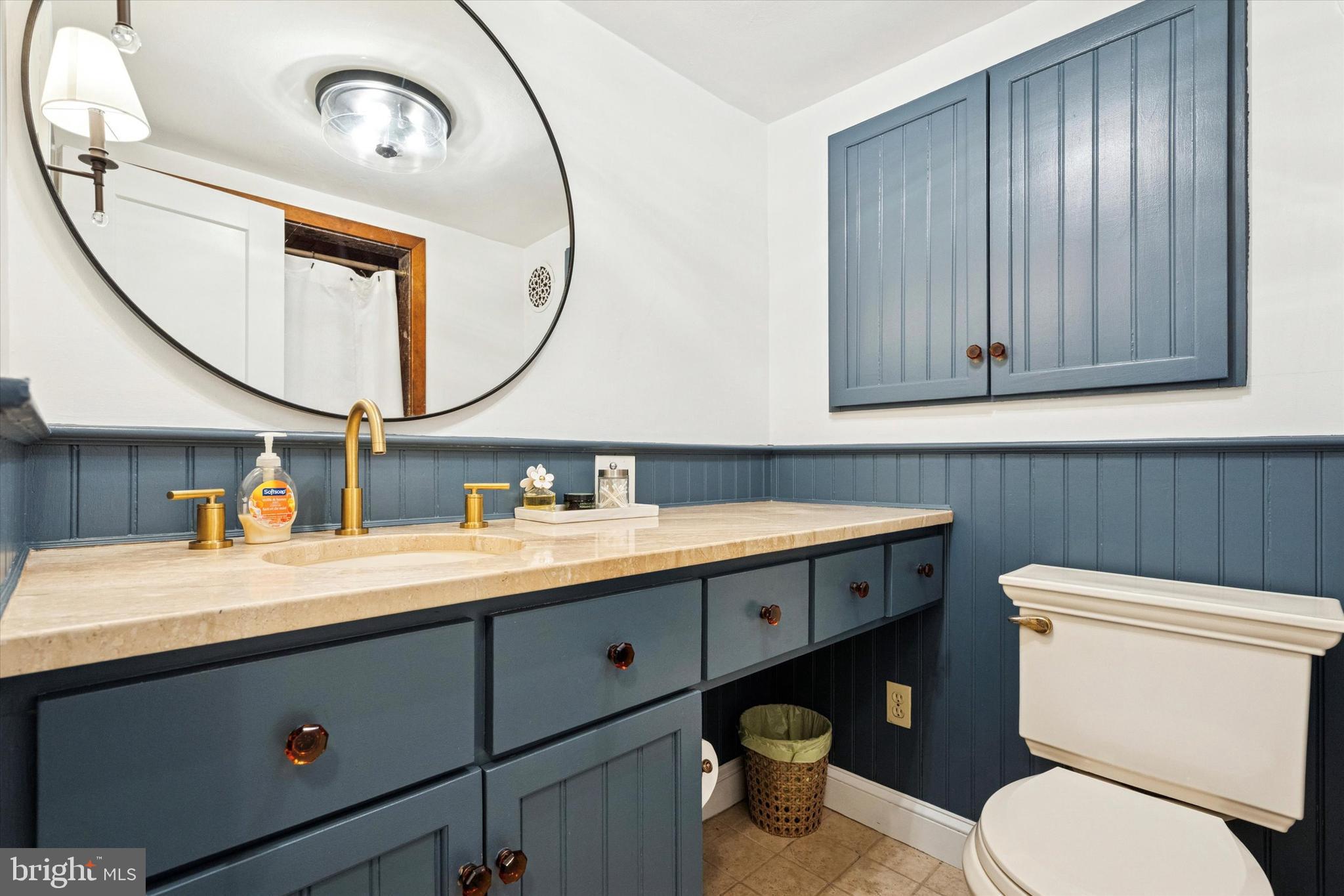 315 Fitzwater Street Philadelphia, PA 19147 - Photo 21 of 32 a bathroom with a toilet a sink and mirror