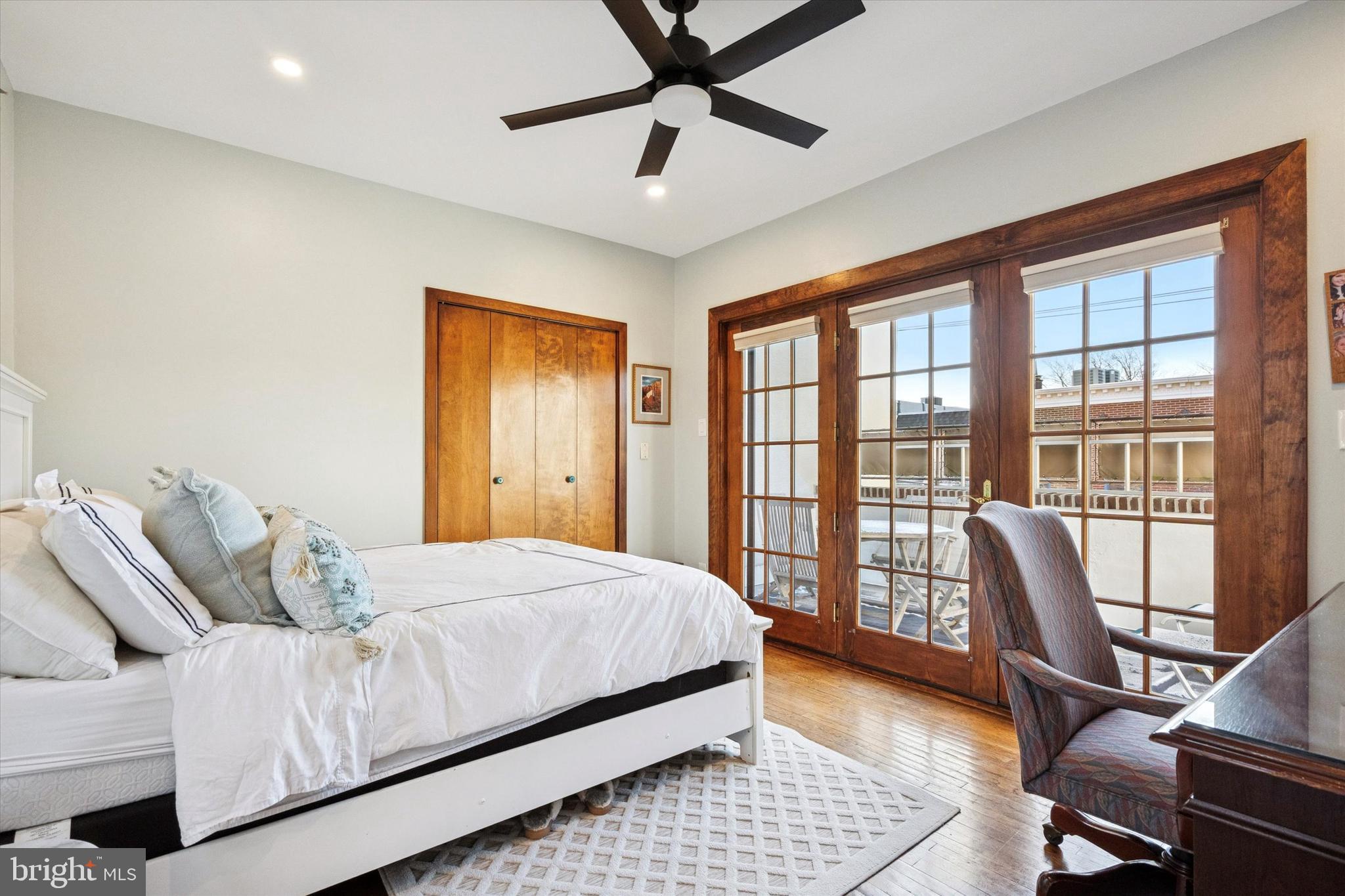 315 Fitzwater Street Philadelphia, PA 19147 - Photo 24 of 32 a bedroom with a bed and wooden floor