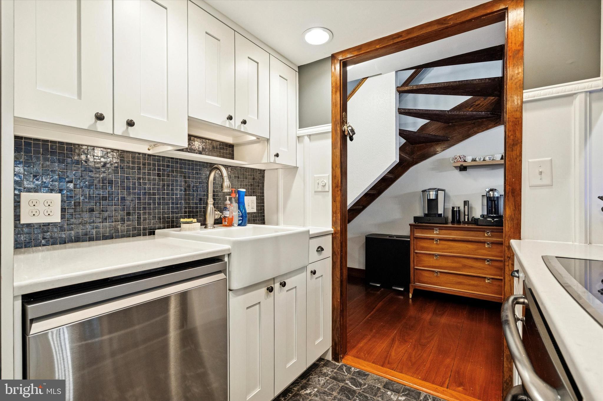 315 Fitzwater Street Philadelphia, PA 19147 - Photo 8 of 32 a kitchen with white cabinets and appliances