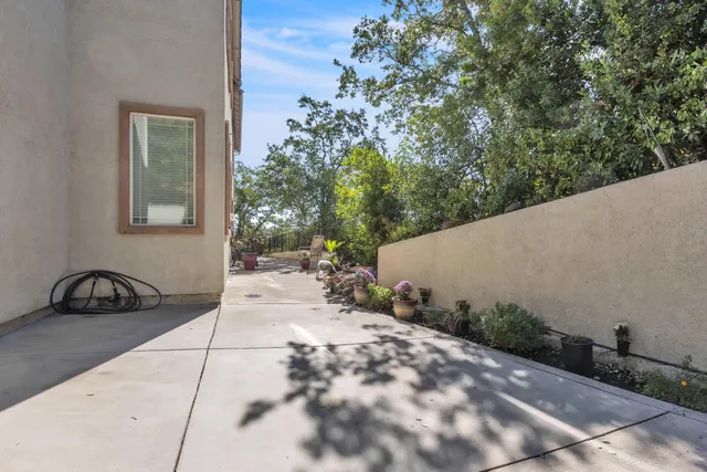 a view of a two chairs in a patio