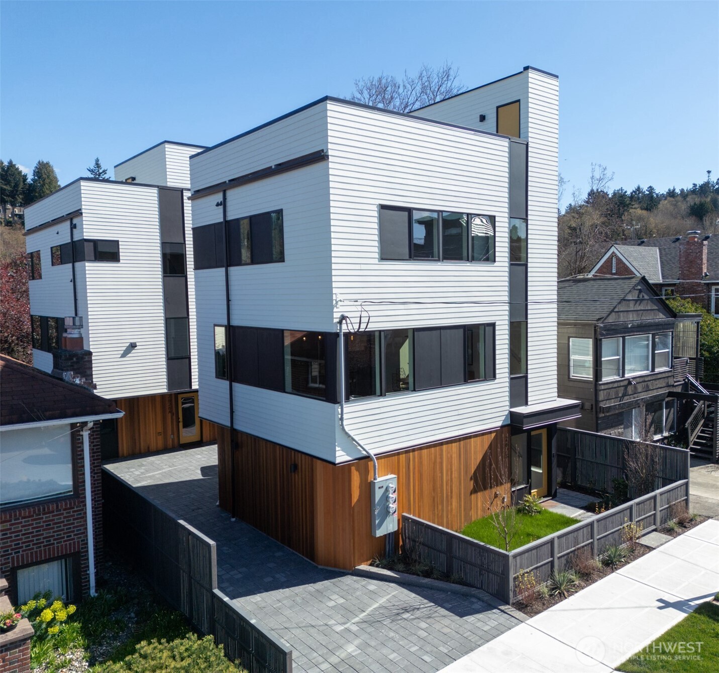 a view of a building with couches chairs