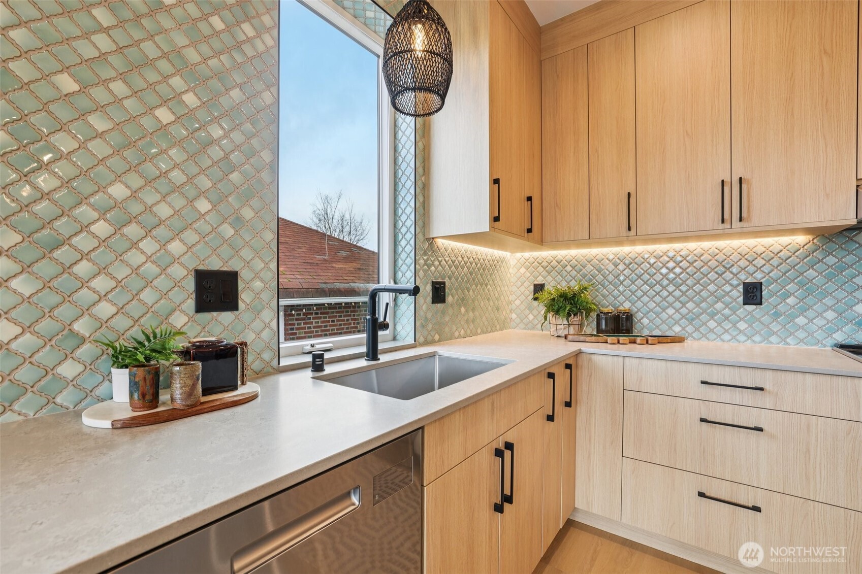 2628 58th Avenue Southwest Seattle, WA 98116 - Photo 13 of 38 a kitchen with stainless steel appliances granite countertop white cabinets and a sink