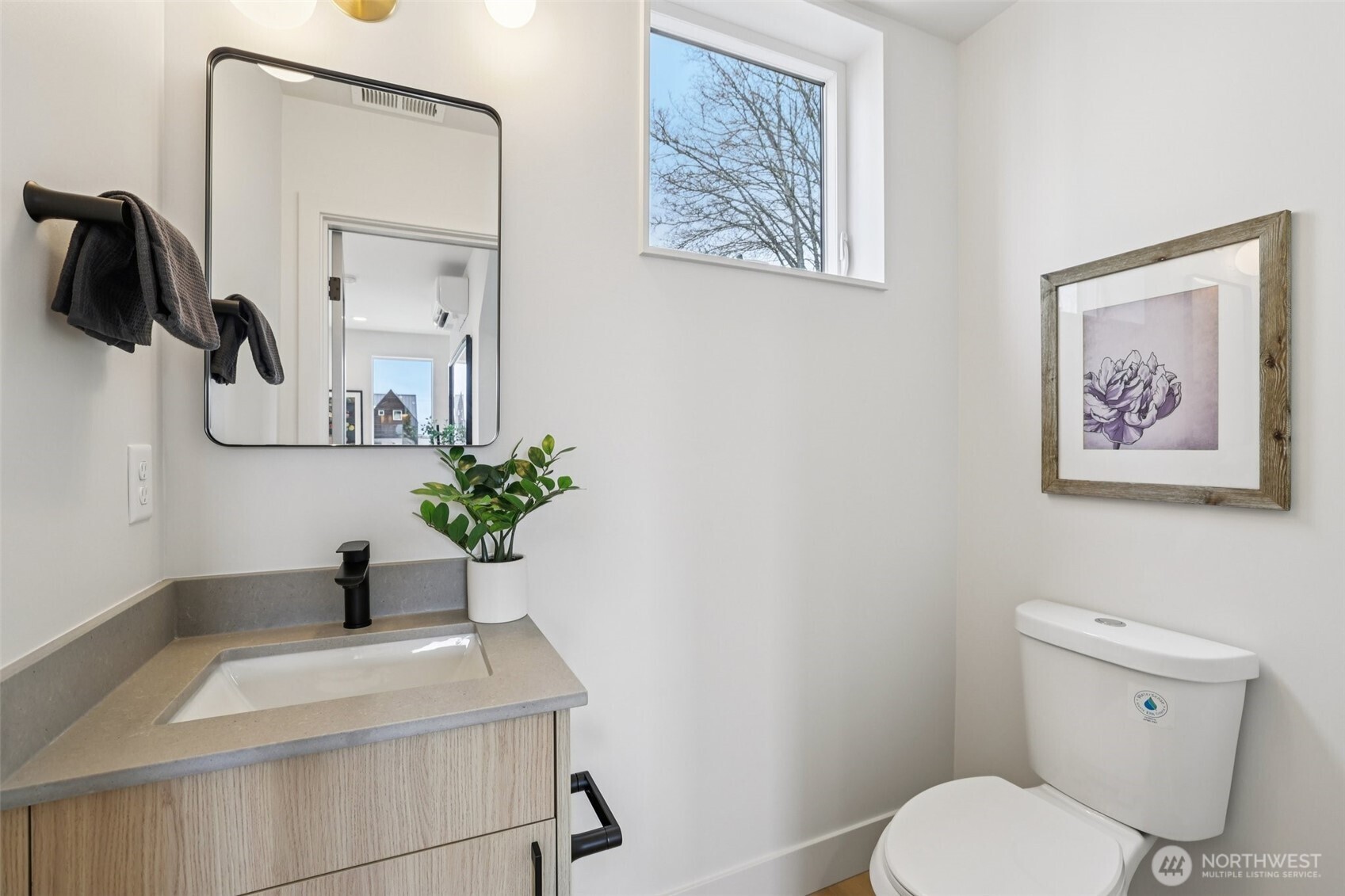 2628 58th Avenue Southwest Seattle, WA 98116 - Photo 15 of 38 a bathroom with a toilet a sink and mirror