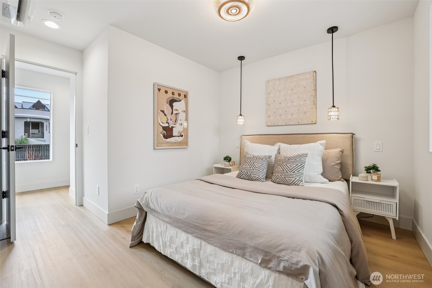 2628 58th Avenue Southwest Seattle, WA 98116 - Photo 24 of 38 a bedroom with a bed and a lamp