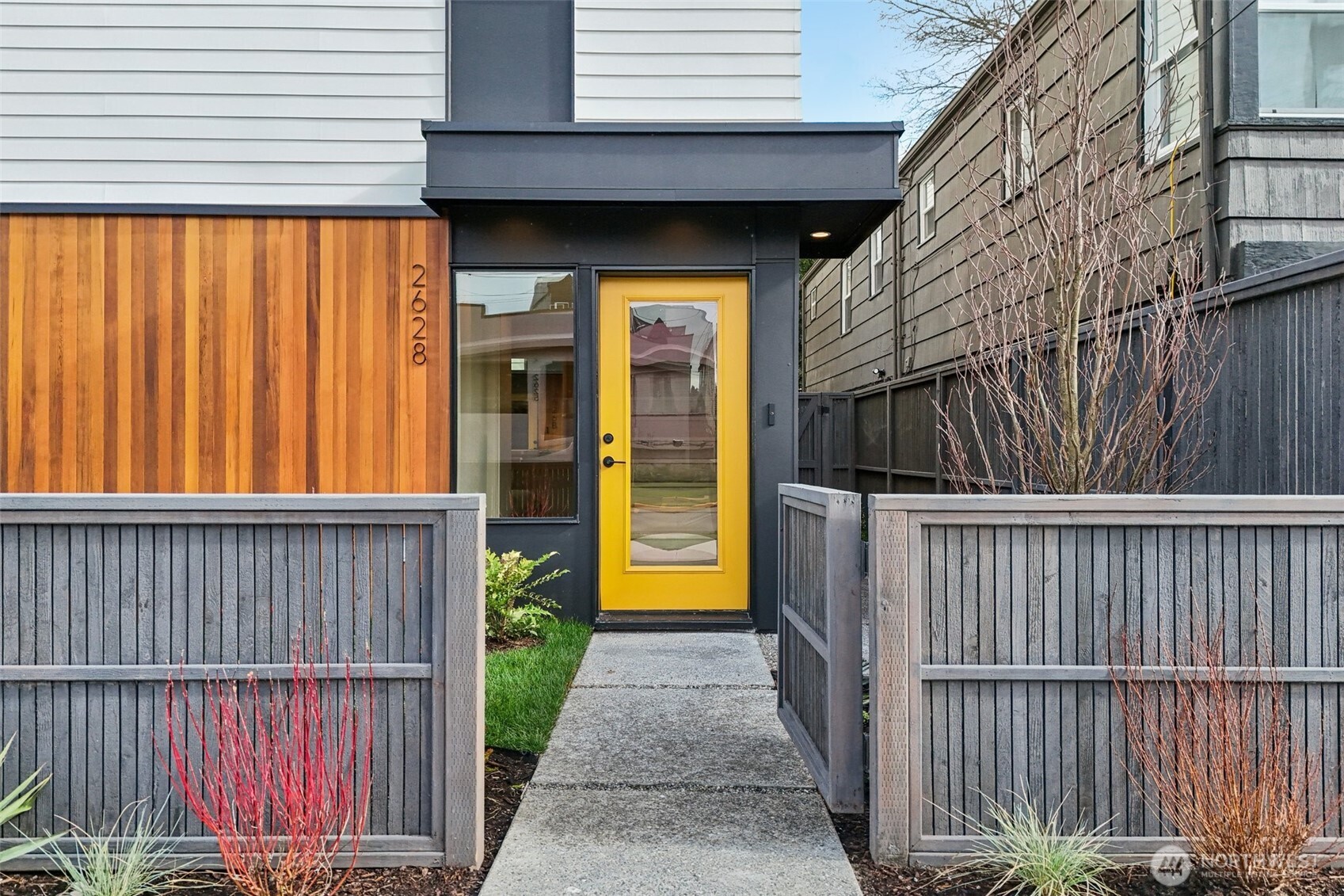 2628 58th Avenue Southwest Seattle, WA 98116 - Photo 4 of 38 a view of a porch with wooden floor and fence