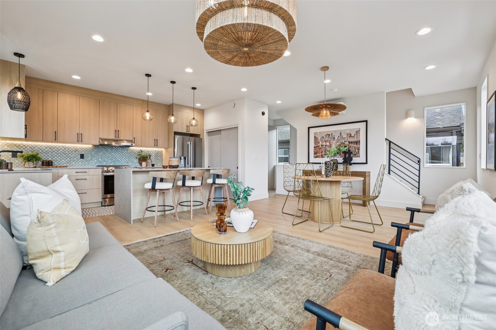 2628 58th Avenue Southwest Seattle, WA 98116 - Photo 5 of 38 a living room with stainless steel appliances kitchen island furniture and a view of kitchen