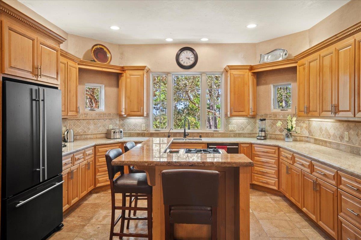 2970 Congress Road Pebble Beach, CA 93953 - Photo 14 of 37 a kitchen with cabinets a oven and a refrigerator
