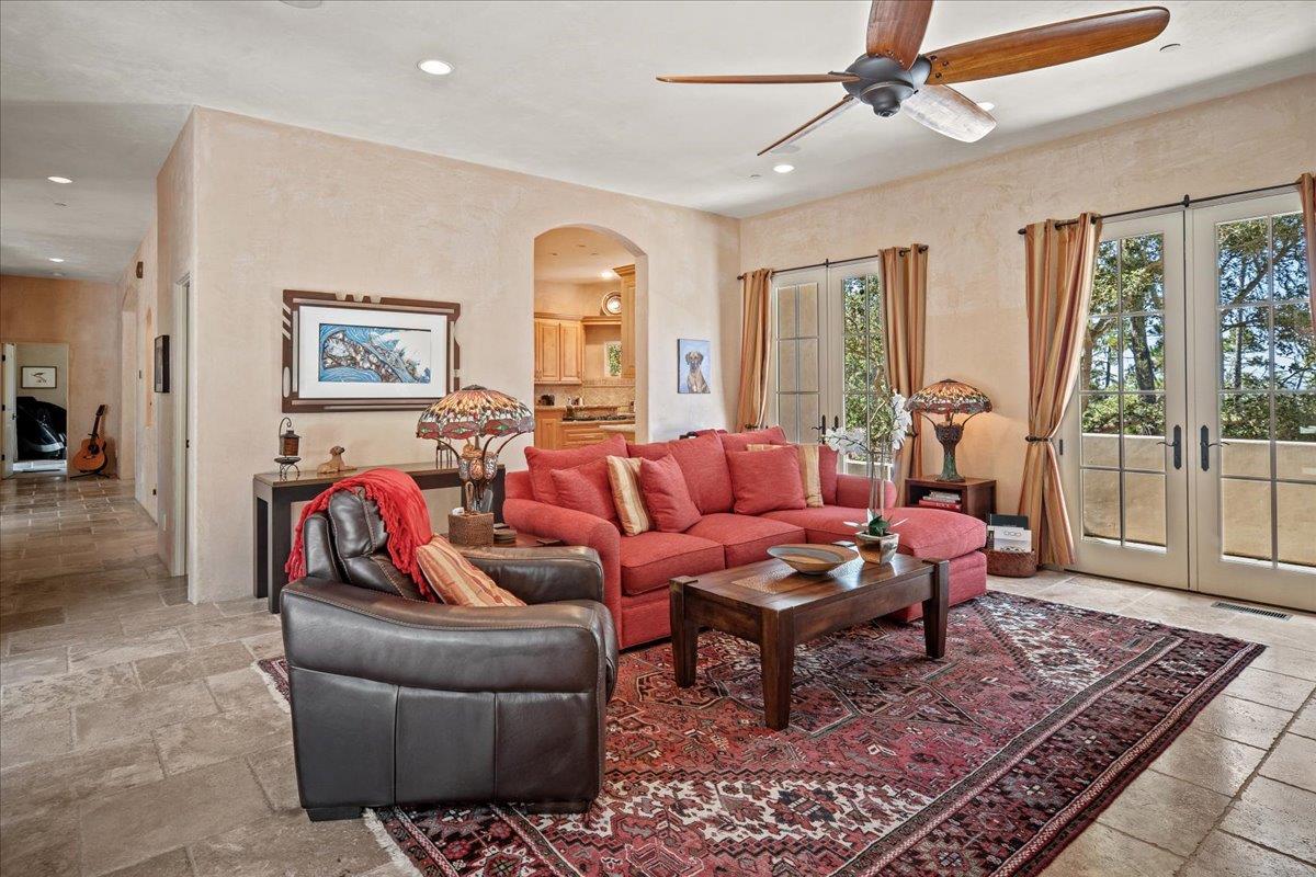 2970 Congress Road Pebble Beach, CA 93953 - Photo 17 of 37 a living room with furniture and a rug