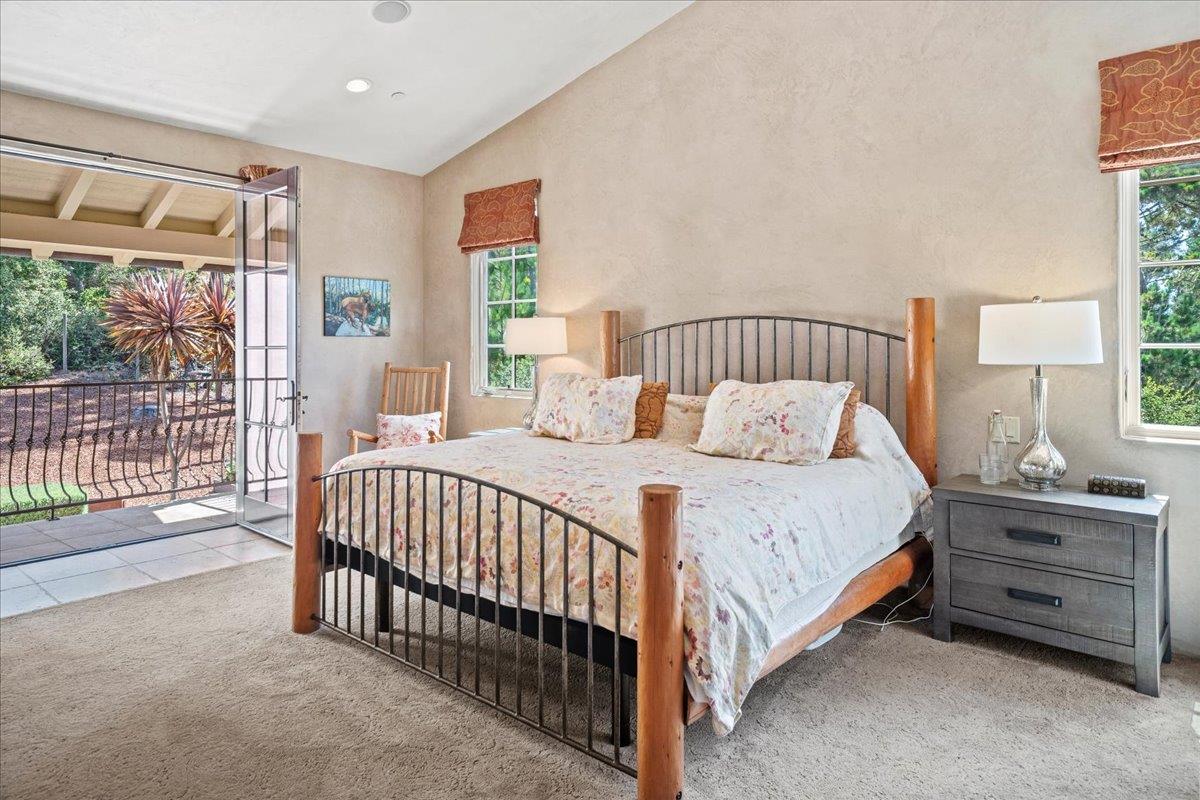 2970 Congress Road Pebble Beach, CA 93953 - Photo 23 of 37 a bed sitting in a bedroom next to a window