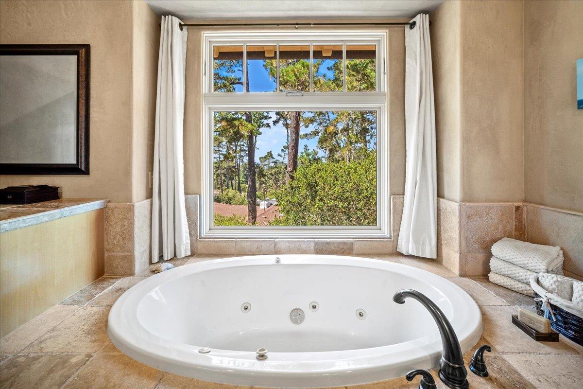 2970 Congress Road Pebble Beach, CA 93953 - Photo 24 of 37 a bathroom with a tub and a window