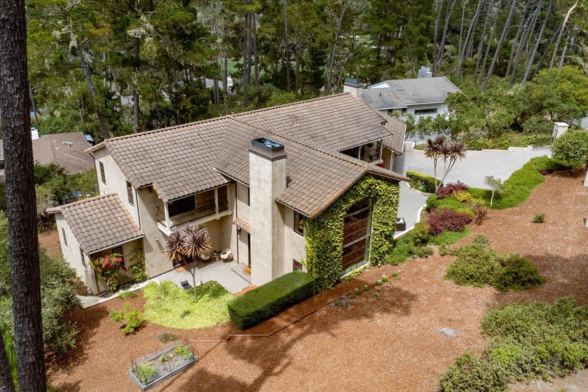 2970 Congress Road Pebble Beach, CA 93953 - Photo 36 of 37 an aerial view of a house with a yard and trees all around