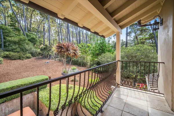 a view of balcony with furniture