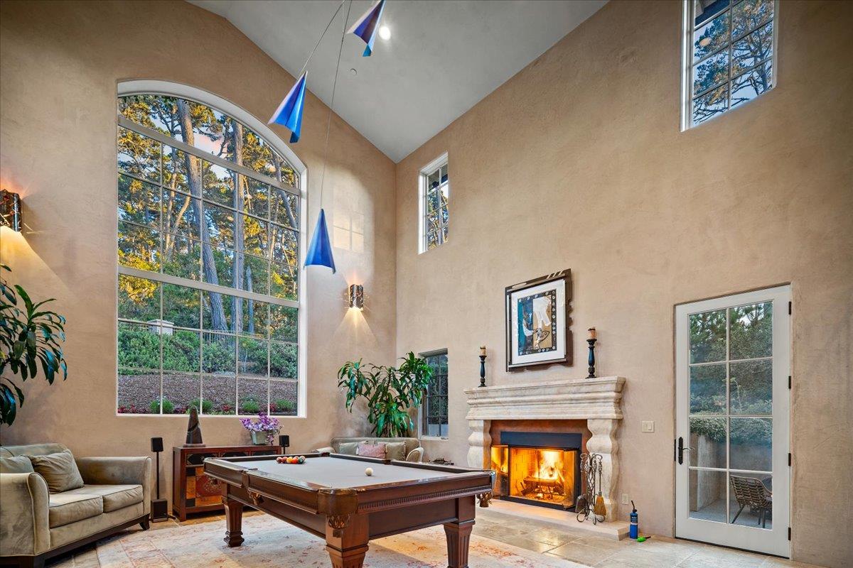 2970 Congress Road Pebble Beach, CA 93953 - Photo 8 of 37 a living room with furniture a window and a fireplace