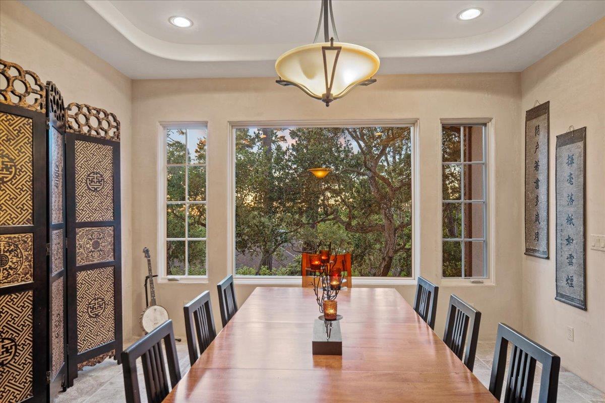 2970 Congress Road Pebble Beach, CA 93953 - Photo 10 of 37 a view of a dining room with furniture wooden floor and chandelier