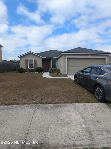 a view of a car parked in front of a house