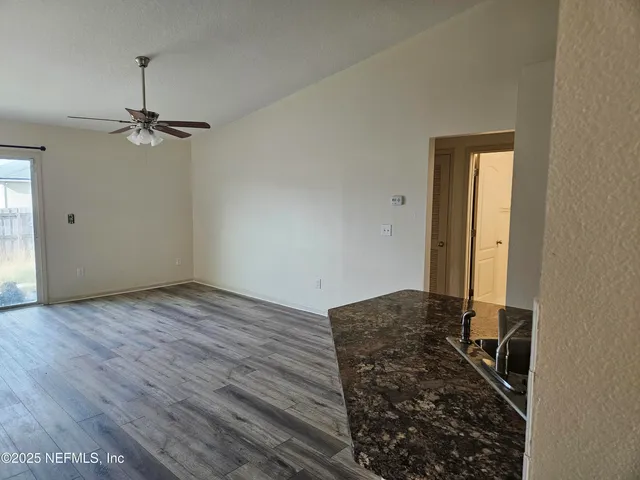 a view of a livingroom with wooden floor