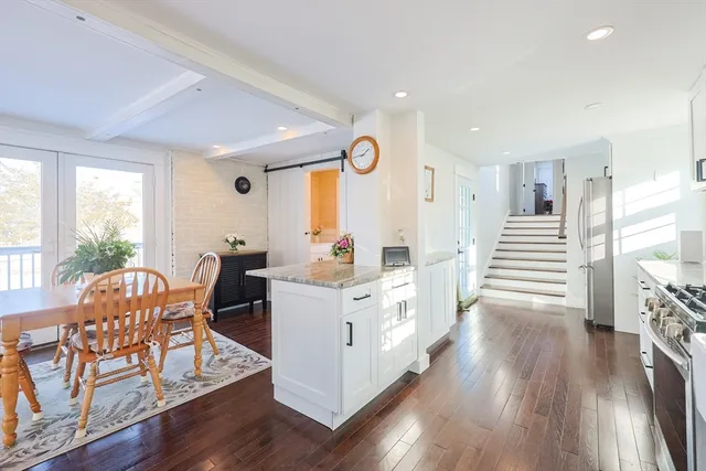 a view of kitchen with cabinets and wooden floor