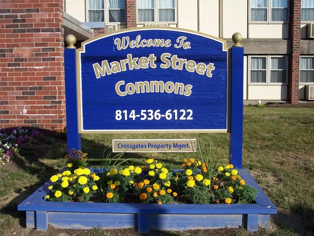 a sign on the side of a brick building