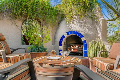 a front view of a house with outdoor seating