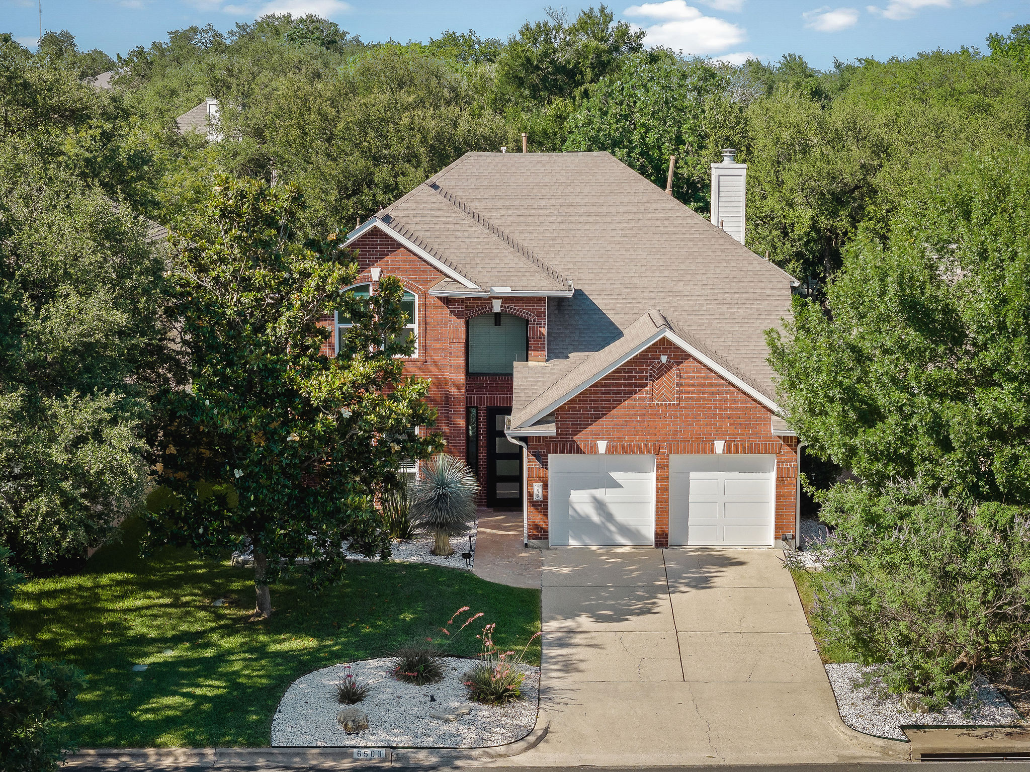 6500 Clay Allison Pass Austin, TX 78749 - Photo 2 of 39 Brick exterior with two-car garage