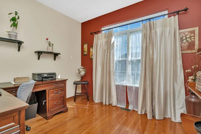 a kitchen with stainless steel appliances granite countertop a stove and a wooden floors