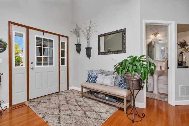 a living room with furniture and a potted plant