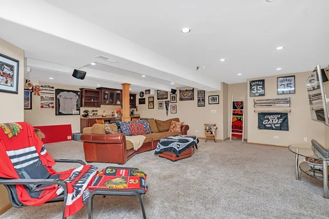 a living room with lots of furniture and a flat screen tv