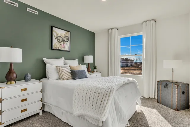 a bedroom with a bed and a view of bathroom