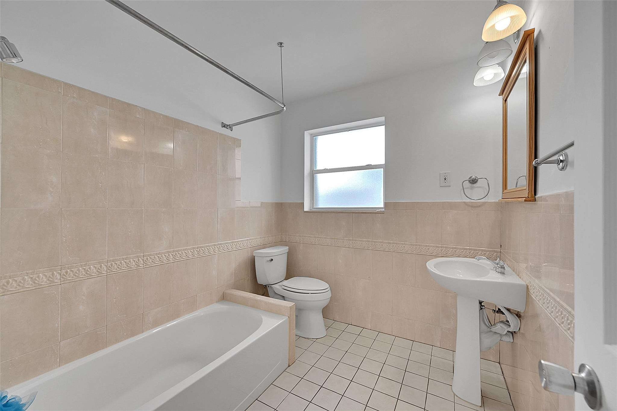 220 Southeast 10th Street Pompano Beach, FL 33060 - Photo 25 of 42 a bathroom with a sink a toilet and shower