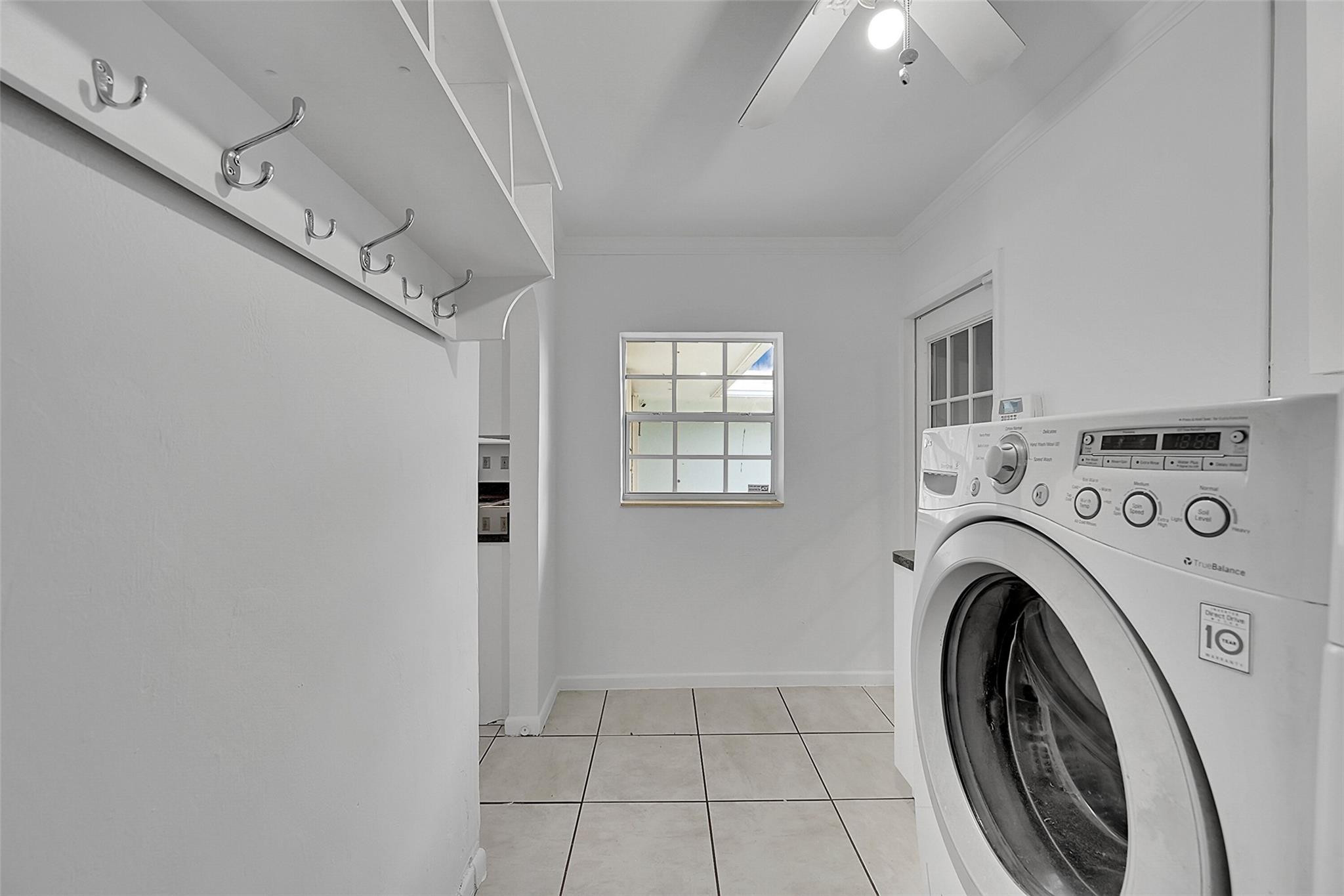 220 Southeast 10th Street Pompano Beach, FL 33060 - Photo 26 of 42 a view of a hallway with washer and dryer