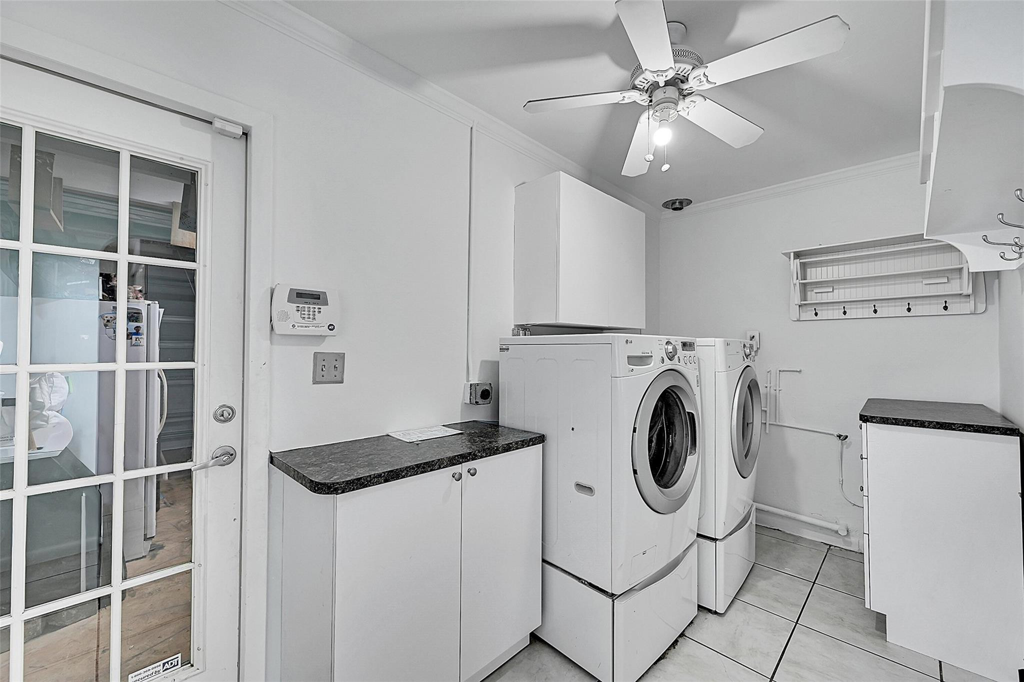 220 Southeast 10th Street Pompano Beach, FL 33060 - Photo 27 of 42 a utility room with dryer and washer