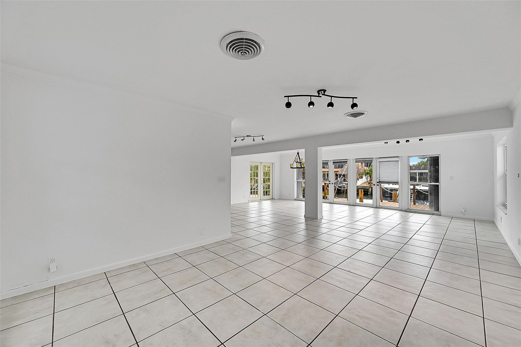 220 Southeast 10th Street Pompano Beach, FL 33060 - Photo 5 of 42 a view of an empty room with window