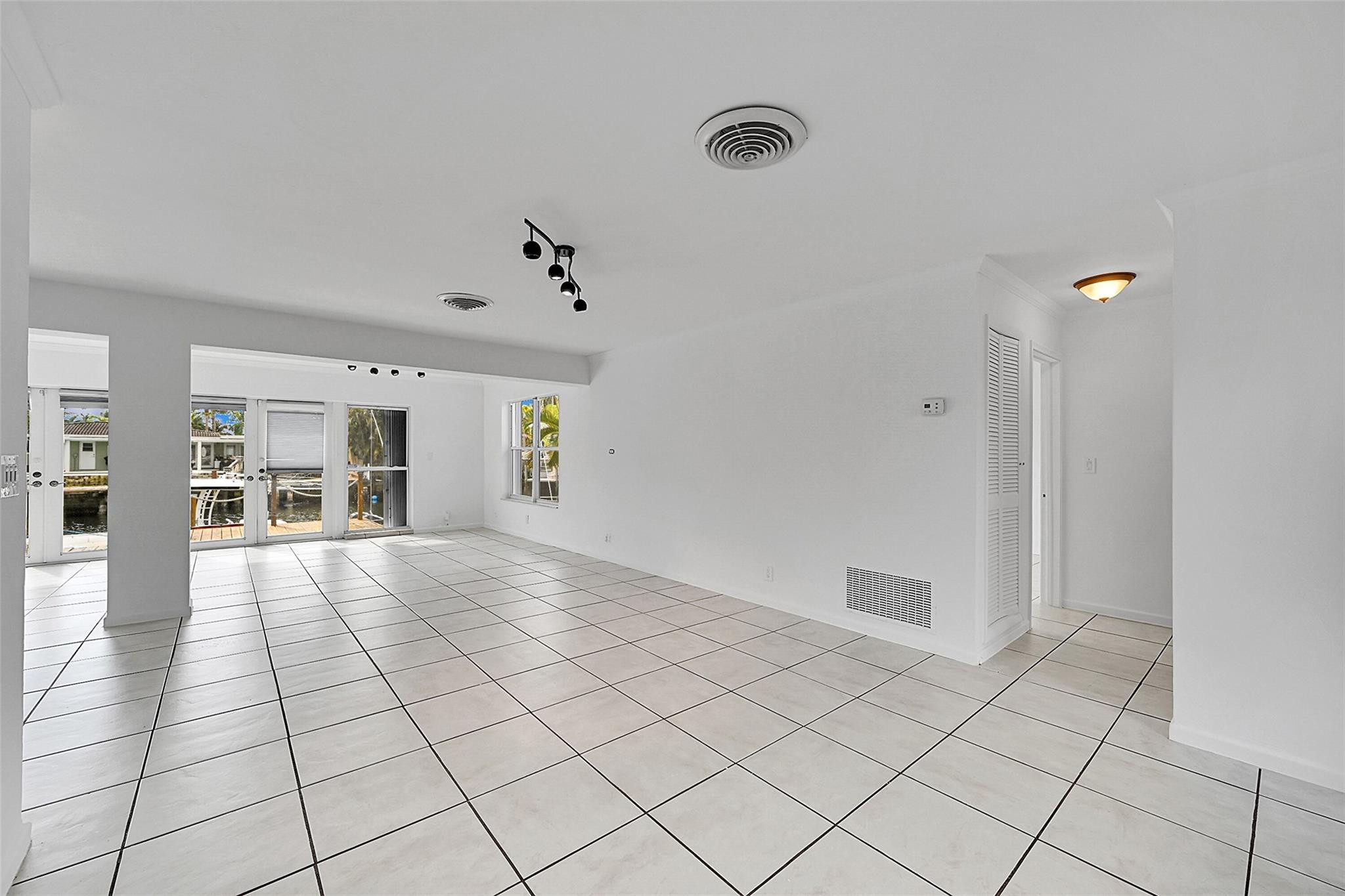 220 Southeast 10th Street Pompano Beach, FL 33060 - Photo 6 of 42 a view of an empty room and window